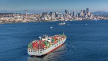 Container ship Cosco Taicang sails Elliott Bay to downtown Seattle's terminal cranes