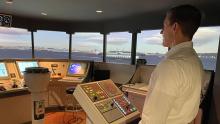 Commissioner Ryan Calkins on the vessel piloting simulator at the Maritime Institute of Tech. and Grad Studies October 2021