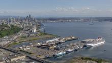 Aerial photo of Terminal 91 with cruise ships and commercial fishing vessels docked at the pier