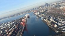 Aerial view of East Waterway container terminals and downtown Seattle skyline in the distance