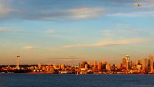 seattle skyline with plane flying overhead