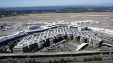 Aerial view of SEA Airport from the west with Puget Sound in the background