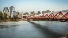 Peace bridge for pedestrians spans the Bow river in Calgary Alberta and looks similar to the helix of a finger-trap