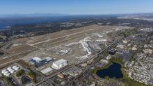 Decorative: Aerial view of SEA Airport viewing southeast toward the sound and mountains