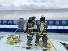Crews drill on safe entry to an aircraft
