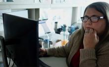 Cassie Fritz sitting at her computer