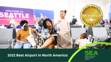 A photo of a family traveling with the caption and award 2022 Best Airport in North America