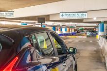 A car entering Reserved Parking in the SEA airport garage.