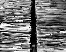 Stack of paper documents. 