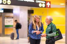 Volunteer helping a customer.