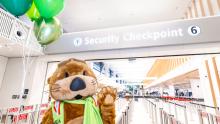 Jett the SEA Otter celebrates the opening of Checkpoint 6 with balloons