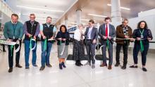 Representatives from the Port of Seattle, Alaska Airlines, and Hensel Phelps cut the ribbon at the SEA Gateway Project's Grand Opening recognition event