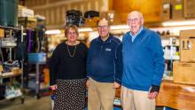 Gayle, Andy, and Joe Carrol inside TW Carrol, their luggage repair shop