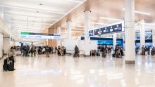 Travelers moving through the newly remodeled north end of SEA Airport's main terminal