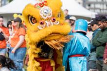 Community festival with Asian dragon costumes