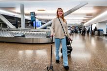 Traveler with a can walking through baggage claim