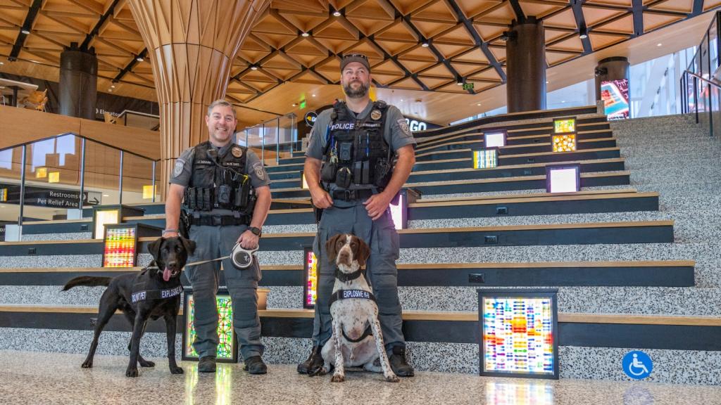 Canine and human police officers at SEA airport
