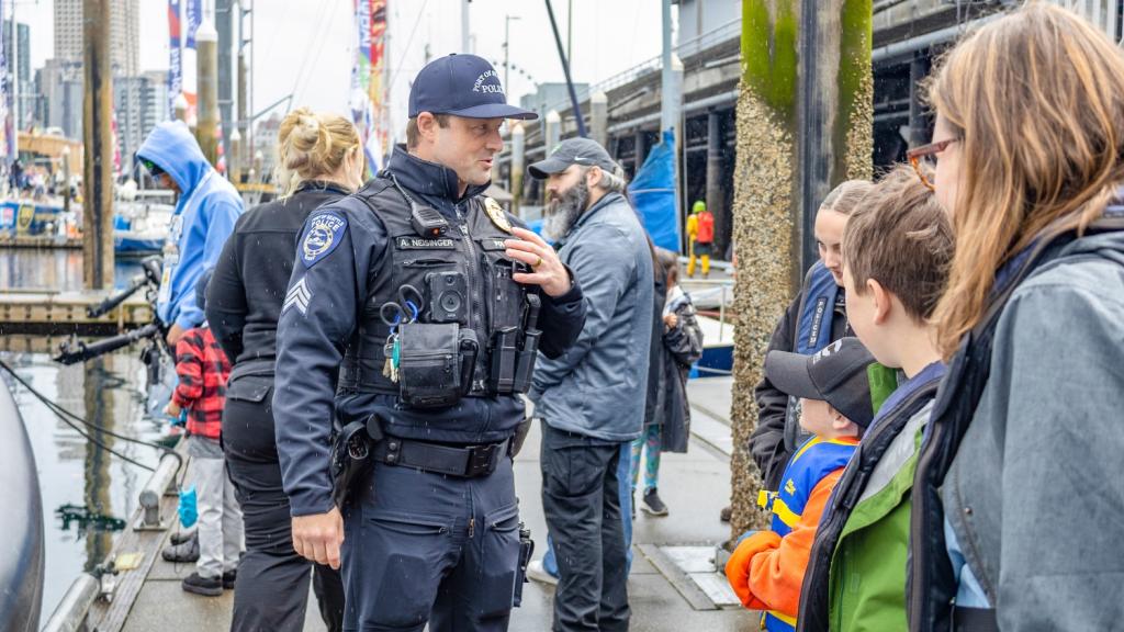 Police officers talking with teenagers